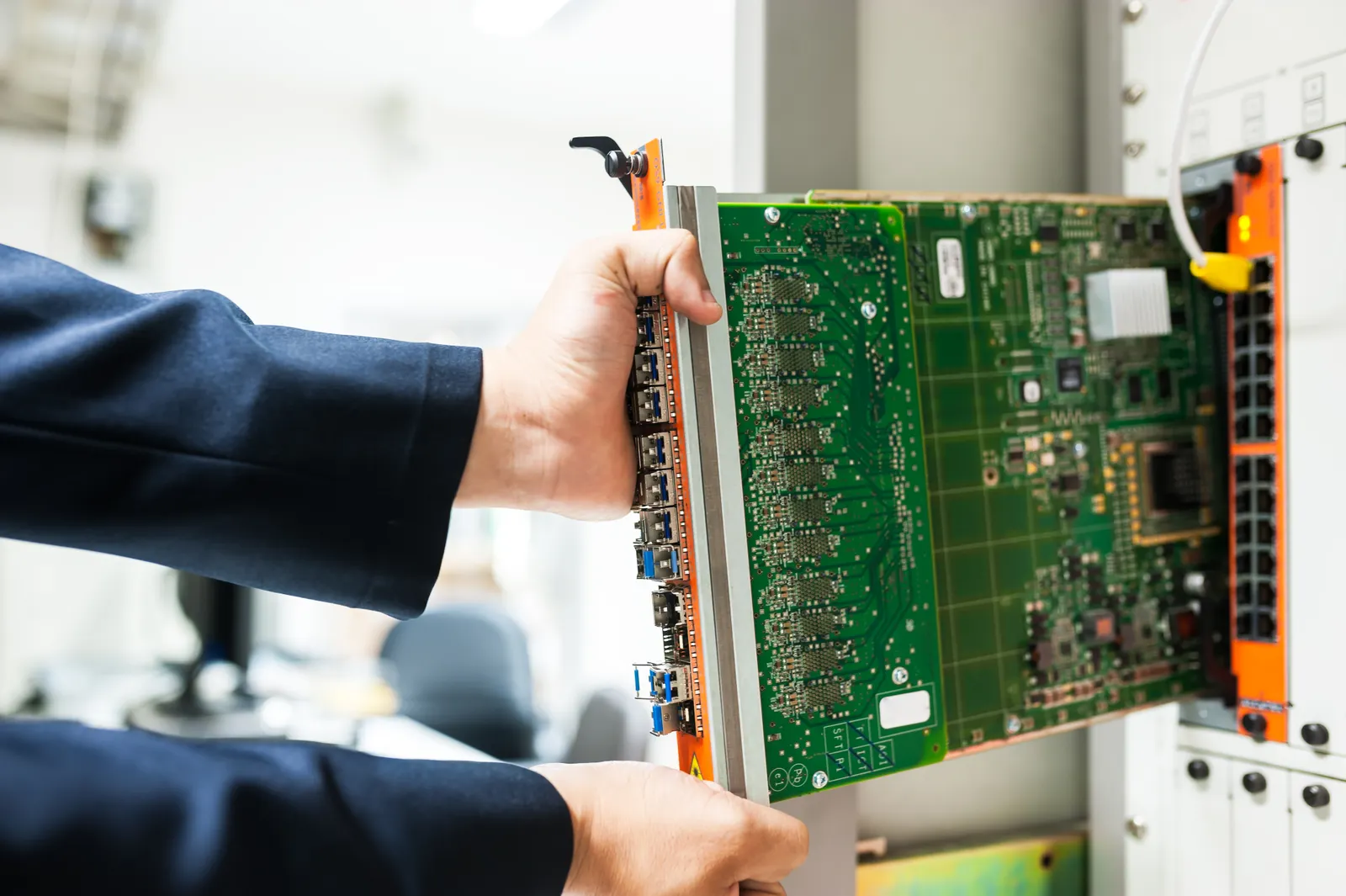 Technician configuring network equipment in a data center